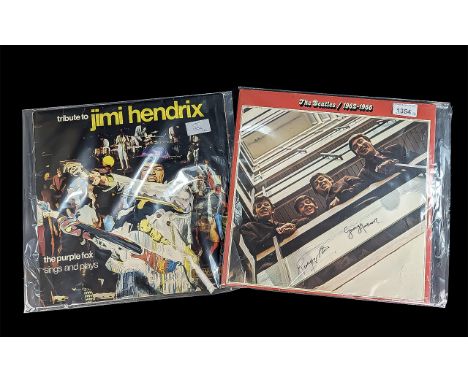 Two Collectible Vinyl Albums, comprising The Beatles 1962-1966 Double Album, signed Ringo Starr and George Harrison, and Trib
