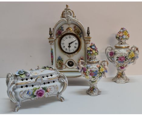 A German porcelain clock two urns and box A/F.