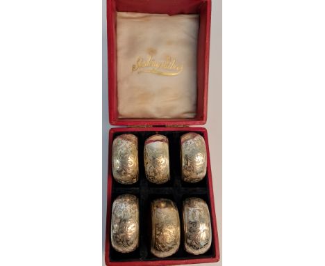 A set of six silver napkin rings, some hallmarked housed in fitted box, approx. total weight 70gms