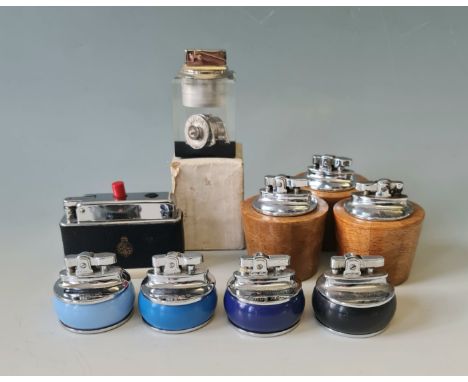 Eight Lucas table lighters and one Transpalie Lucas lighter.