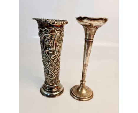 A hallmarked silver tapered flute vase, approx. height 20cms, approx. weight 138gm and a fluted decorative vase, approx. heig