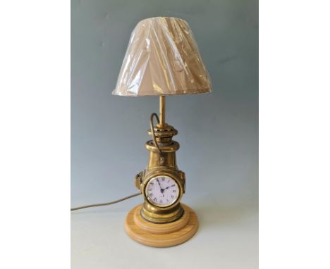 A converted Powell &amp; Hanmer brass lamp, clock table light.