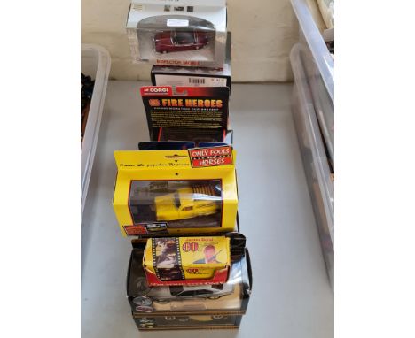 Twenty Corgi boxed vehicles James Bond, Batman, and Fire heroes.