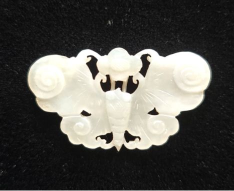 A pale green jade butterfly pendant.