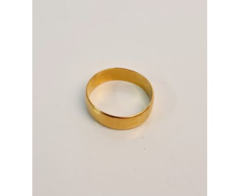 A rubbed hallmarked 22ct yellow gold wedding band, ring size R 1/2, approx. weight 5.3gms