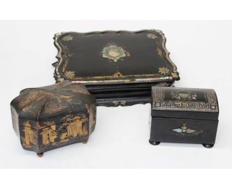 A Victorian papier mache shaped rectangular slope front writing box, the cover inlaid with mother-of-pearl cartouche with gil