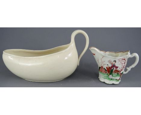 An eighteenth century hand-painted porcelain Chelsea ewer-shape Worcester creamer and a creamware bourdaloue. (2)Condition: f