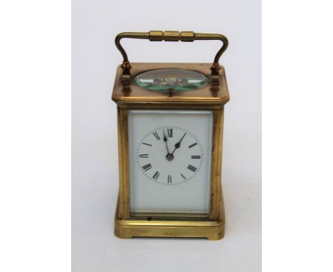 An early 20th century brass, five glass carriage clock with eight day gong striking repeating movement and enamel Roman dial,