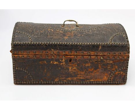 A small Victorian brass studded hide covered trunk with brass carry handle, 50cm wide