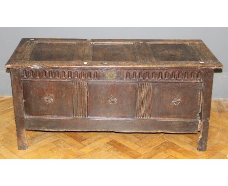 A late 17th century oak coffer, three panel top and front with stop fluted frieze, on stile supports with vacant interior. 13