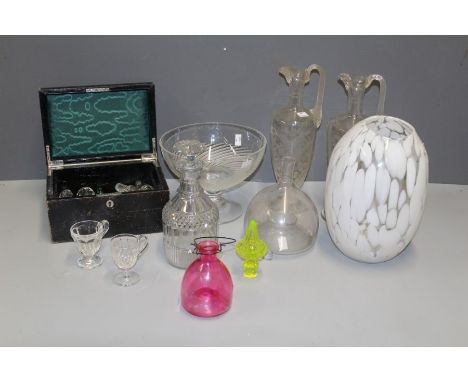 A good mixed lot of glassware, including a 19th century wasp trap, decanters, a collection of stoppers, tinted and other drin