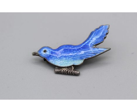 An enamelled white metal brooch in the form of a bluebird. The enamel is in good condition with limited superficial scratches