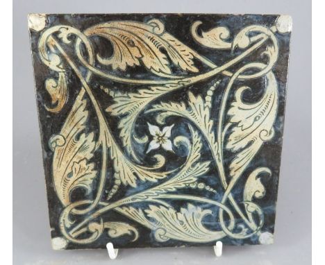 A Martin Brothers stoneware floor tile decorated in buff tones in a geometric form. 15 cm wide. Marked to reverse; MARTIN BRO