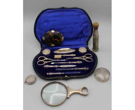 A collection of silver to include: an Edwardian 10 piece cased silver mounted&nbsp;manicure set, hallmarked by E S Barnsley &