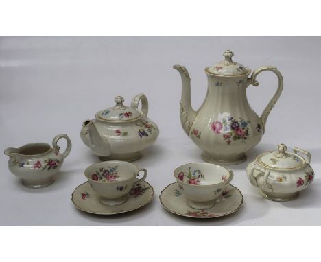 A mid 20th century Bavarian porcelain tea service, comprising tea and coffee pots, cream and lidded sugar, twelve cups, sauce