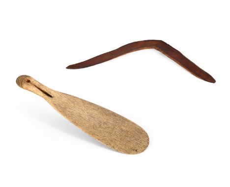 A MĀORI WHALEBONE HAND CLUB OR PATU PARAOA NEW ZEALAND The handle pierced with a hole, the top with four incised curved ridge