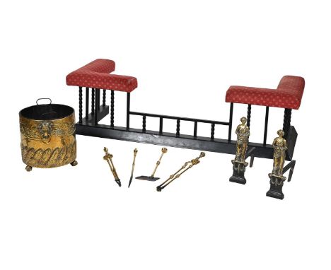 A SELECTION OF FIREPLACE FURNITURE 19TH CENTURY Comprising a pair of cast-iron brass fire-dogs, each in the form of a standin