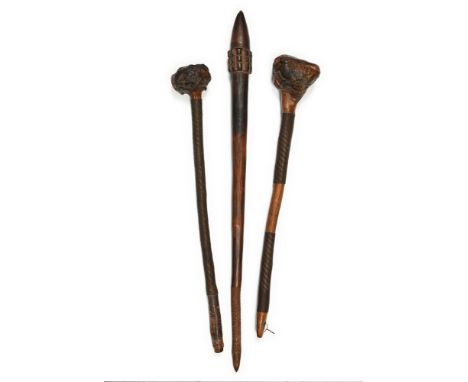 A GROUP OF THREE CLUBS 19TH CENTURY  One is Aboriginal, the other two possibly from Zimbabwe  the largest 77.5cm, the smalles