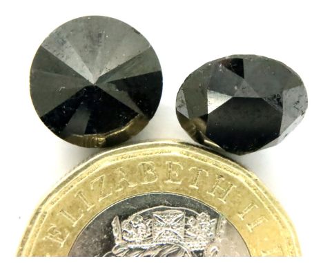 Two loose AIG certified black diamonds, each over 4cts. P&amp;P Group 1 (£14+VAT for the first lot and £1+VAT for subsequent 