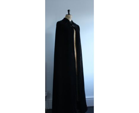 1930s black silk velvet and silk lined floor length cape/cloak. Bias cut with a winged collar and two large button fastening.