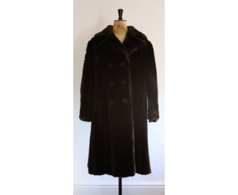 1970s Faux Fur Coat by Hamells. Made in Tissavel simulated mink fabric with a lapel collar and faux button front fastening. S