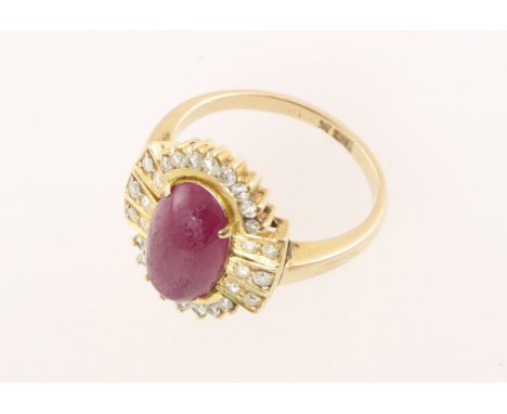 A modern cabochon ruby & diamond cluster ring, diamond weight approx 0.30cts, stamped 18k & approx 5.1gms