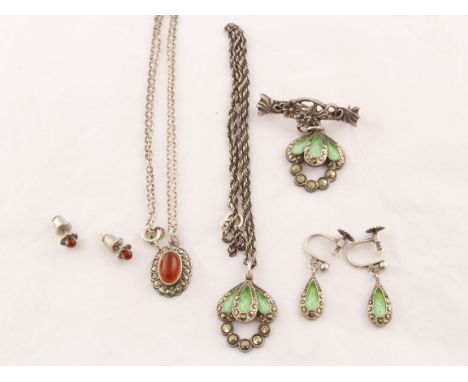 A set of marcasite & green enamel pendant, brooch & ear pendants each stamped 'SILVER', together with another marcasite & car