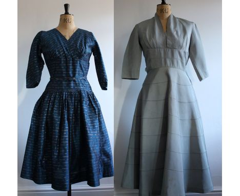 A pair of 1950s dresses labelled Bijou and Rodney.A dove grey rayon grosgrain dress by Bijou. Circle skirt and fitted bodice,