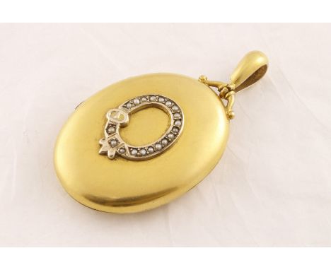A large Victorian gilt 'back & front' locket with applied pearl set belt decoration, approx 12.5gms