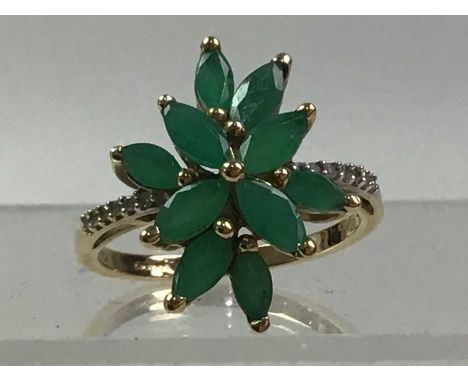 TWO EMERALD AND DIAMOND DRESS RINGS, each in nine carat goldQty: 7.1g grossThe one that is the flower shape is size Q, the ot