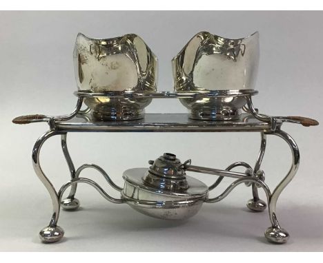 COLLECTION OF SILVER PLATED ITEMS, comprising an early 20th century pair of sauceboats on a warming stand with spirit lamp, o