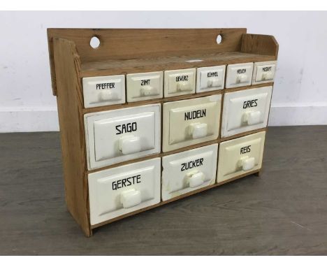 GERMAN SPICE CHEST, MID 20TH CENTURY constructed in pine and with ceramic drawers54cm wide