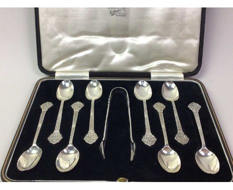 SET OF EIGHT SILVER COFFEE SPOONS AND TONGS, each with Celtic cross to terminal, boxed