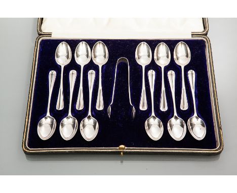 SET OF TWELVE SCOTTISH GEORGE V SILVER TEASPOONS AND TONGS
maker R & W Sorley, Glasgow 1917, inverted rat's tail pattern hand