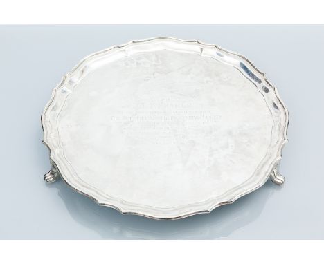 SILVER SALVER
maker Cooper Brothers & Sons Ltd, Sheffield 1946, with serpentine rim on three bracket feet, engraved with pres