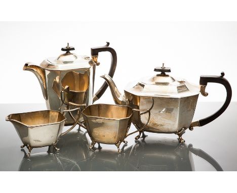 SILVER FOUR PIECE TEA SERVICE
maker Harrison Fisher & Co, Sheffield 1946, of faceted rectangular form, each on four short leg