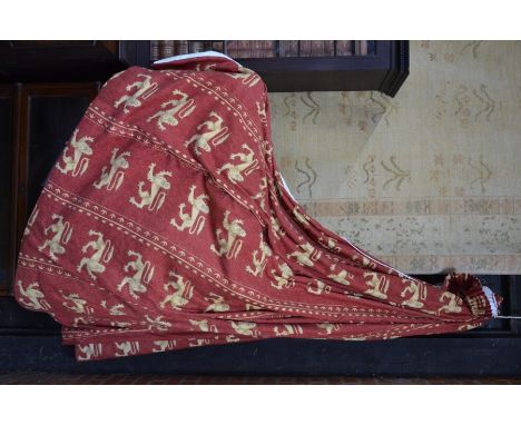 A pair of interlined country house curtains c/w tie backs and pelmets in rich burgundy ground with ochre heraldic lion decora