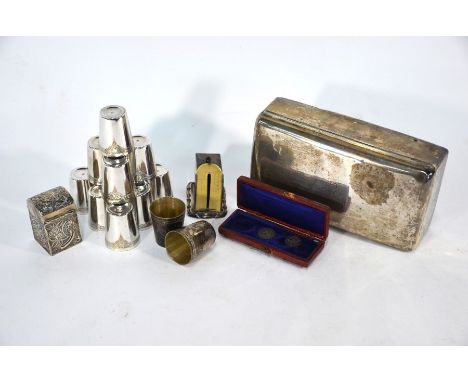 A late Victorian silver cigarette box, Birmingham 1899 to/w an embossed miniature card-box, Chester 1899, miniature silver po