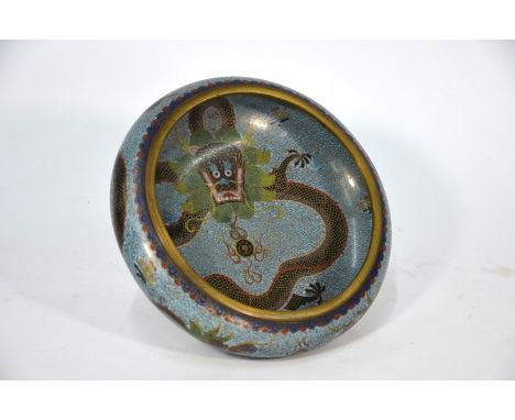 An early 20th century Chinese cloisonne brush washer, decorated on the exterior in polychrome enamels with two dragons disput