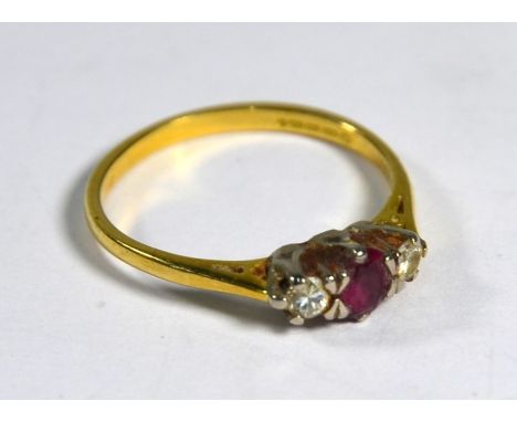 An 18ct yellow gold ring set with ruby and two diamonds, size P