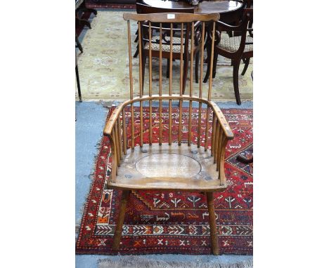 A 19th century comb-back Windsor armchair (converted as birthing chair)