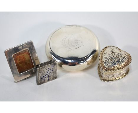 A late Victorian silver 'pebble' snuff-box, Saunders &amp; Shepherd, Birmingham 1895, 6.3 cm diam, to/w a floral-embossed hea