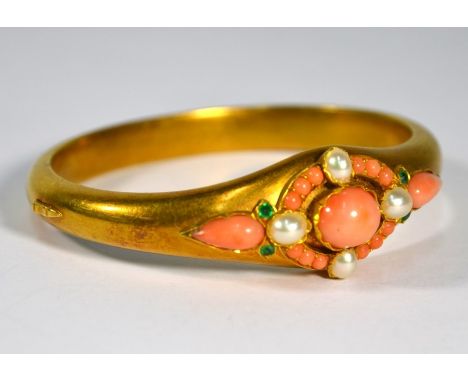 A Victorian bloomed yellow gold half hinged bangle with coral, pearl and emerald decoration, 7 cm diam, 26.7 g all inGood ori