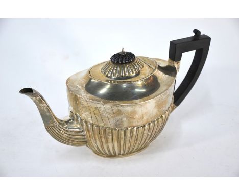 A silver oval half-reeded teapot with composite handle, Harrison Bros &amp; Howson, Sheffield 1924, 15oz gross (469g)