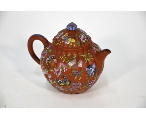 An unusual late 19th or early 20th century Chinese Yixing melon-shaped teapot and cover, the lobed body with a short spout an