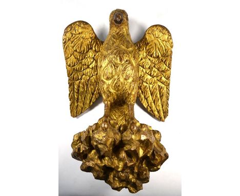 An antique giltwood spread eagle mount / bracket, 36 cm h