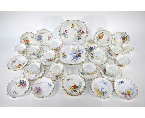 A Royal Worcester china part tea service, printed and painted with butterflies and wildflowers, comprising two sandwich plate