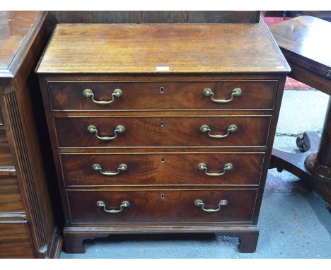 A George III mahogany chest of four long graduated drawers with brass swan-neck fittings, raised on shaped bracket feet, 82 c