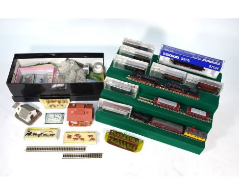 A Fleischmann N-gauge train system, including seven locomotives (one with half box), various carriages and other rolling stoc