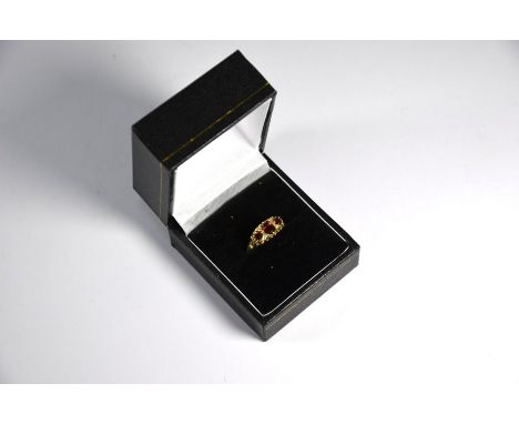 A Victorian style 9ct yellow gold ring set with three graduated garnets and small diamonds, size K,&nbsp;Chips to diamonds